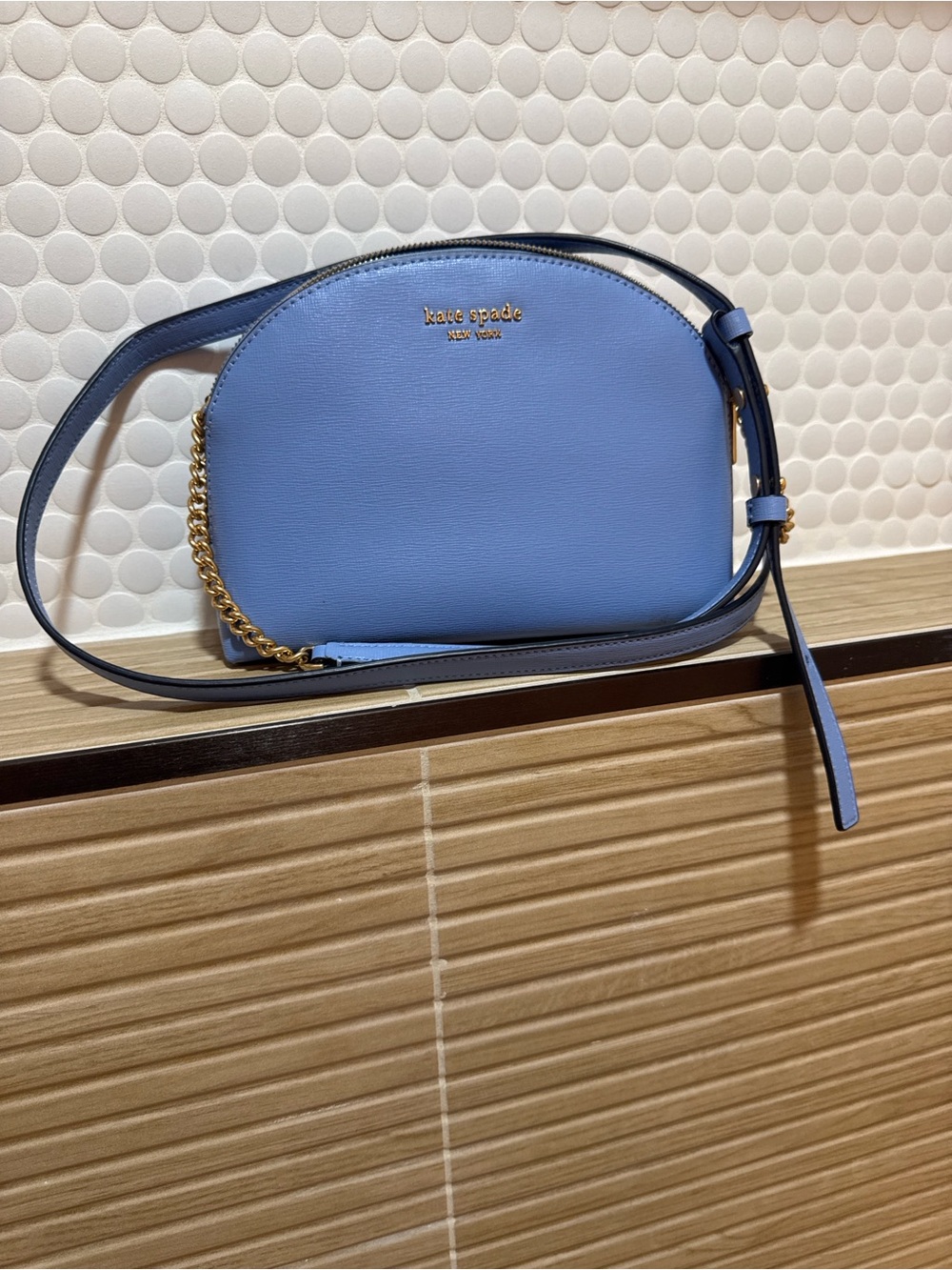 kate spade small dome crossbody in powder blue with gold hardware